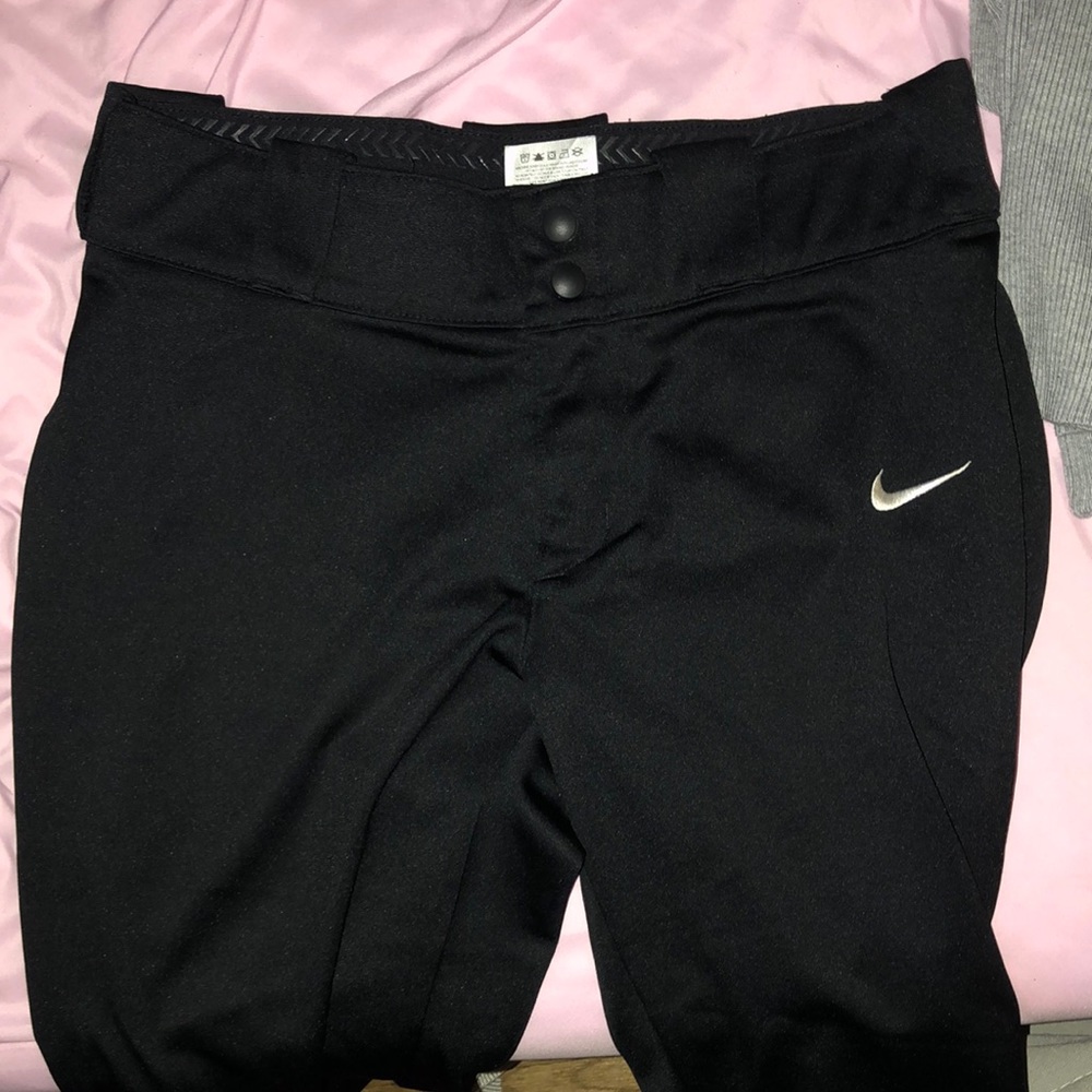 Medium Nike softball pants. Black, and I can include a black belt too:)